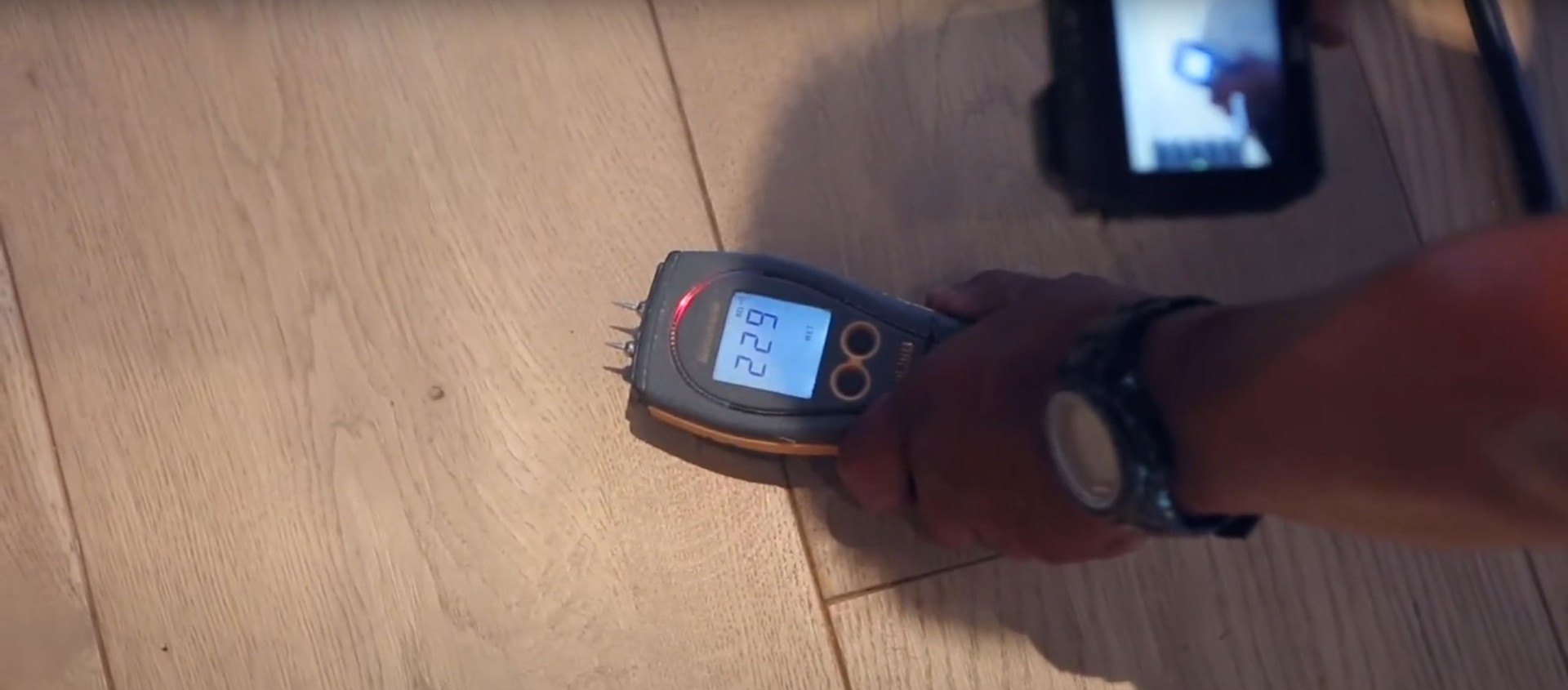 Moisture detection equipment showing humidity readings during water damage assessment